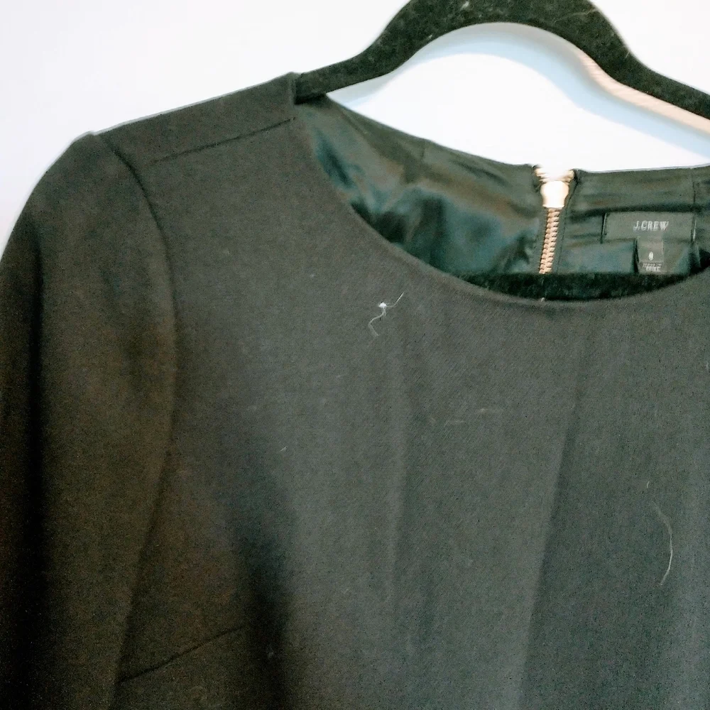 J Crew shift black dress with gold zipper detailing. Size 8, leather elbow patch